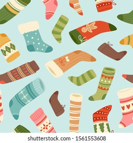 Winter and christmas socks vector seamless pattern. Fashion multi-colored woolen socks for winter holidays. Wrapping paper design for gifts and christmas background.