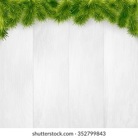 Winter christmas wooden background with fir branches. 