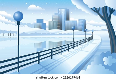 Winter City park with road near the river and city buildings, street lights . Handrail near the river.