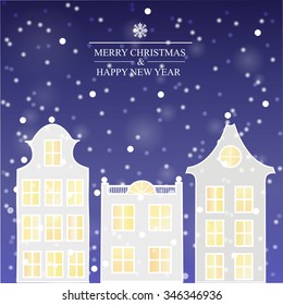 Winter city. Snow falls on building. Sky with snowflakes.