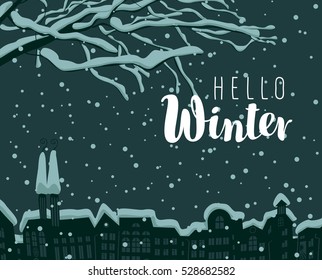 Winter cityscape with a branch of a tree and buildings in the snow