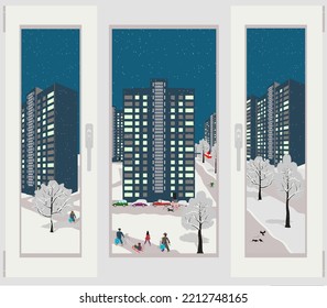 winter cityscape in the evening during snowfall