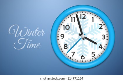 Winter Clocks with snowflake on cold blue wall