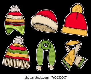 Winter clothes. Santa stocking cap. Knitted hats and Scarfs. Isolated on black background