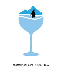 winter cocktail, mountain and penguin inside glass, logo icon