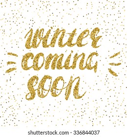 Winter coming soon -  hand painted ink brush pen modern calligraphy. Inspirational motivational quote with golden glitter texture.