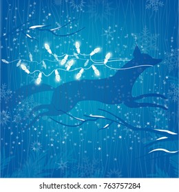 Winter concept Leaping Fox, White Christmas Lights on Blue starry Background and snow-covered branches
