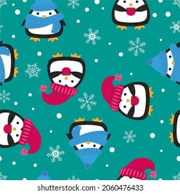 Winter endless background. Cute stylized penguins in warm hats. Seamless repeat pattern. Cartoon doodle. Vector pattern, design for textiles, packaging, paper on a blue background.