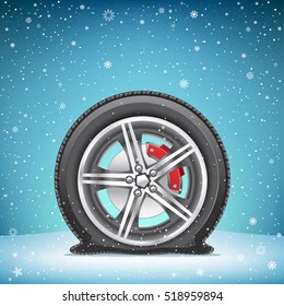 The Winter Flat Tire On Blue Snowy Background. Wheel In The Snow