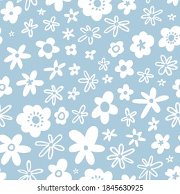 Winter flowers on blue background. Seamless pattern with flowers. Floral vector fabric design or Christmas wrapping paper. 