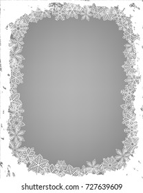 Winter frame Frame made of fluffy snowflakes on soft gray background with space for text.