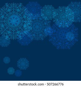 Winter frame with snowflakes over blue background.