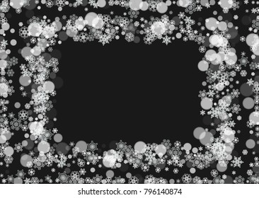 Winter frame with white snowflakes for Christmas and New Year celebration. Horizontal winter frame on black background for banners, gift coupons, vouchers, ads, party events. Falling frosty snow.
