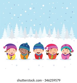 Winter fun. Cheerful kids lying on the snow.