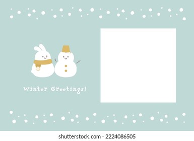 A winter greeting card with a heartwarming photo frame of a snowman and a rabbit