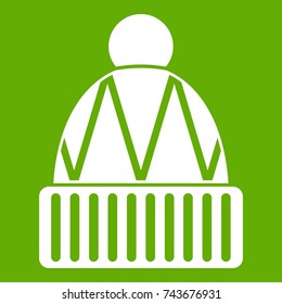 Winter hat icon white isolated on green background. Vector illustration