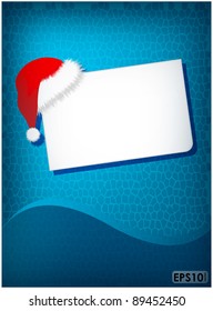 Winter hat and paper leaf on blue mosaic background