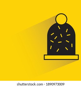 winter hat with shadow on yellow background