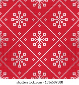 Winter holiday knitted diamond pattern. Red nd white  seamless vector pattern with knitted texture. Cozy christmas background with snowflakes.