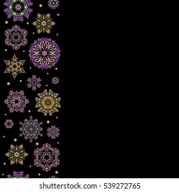 Winter Holiday Knitted Pattern with yellow and pink Circles, Dots and Snowflakes On a Black Background. Seamless vector vertical background.