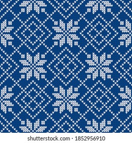 Winter holiday ornament with snowflakes. Christmas and New Year wool knitted sweater. Seamless pattern, vector illustration, traditional background.