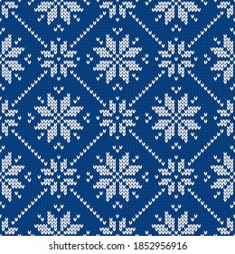 Winter holiday ornament with snowflakes. Christmas and New Year wool knitted sweater. Seamless pattern, vector illustration, traditional background.