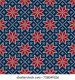 Winter Holiday Seamless Knitted Pattern with a Snowflakes. Blue, Red and White Knitting Sweater Design. Wool Knitted Texture Imitation