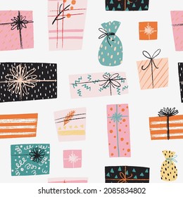 Winter holiday seamless pattern with hand drawn cartoon presents and gift boxes with different wrapping papers, ribbons and decor. Festive Xmas tiling background.