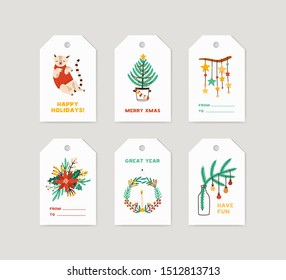 Winter holiday tags set. Christmas labels decorated with pine tree, xmas wreath, seasonal flowers and cute cat on white background. New year congratulation, merry xmas greeting cards collection.