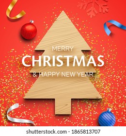 Winter holidays greeting card, with a wooden Christmas tree, balls, ribbons, and golden glitter, on the red background. Colorful Christmas card, with Mery Christmas and Happy New Year greeting text.