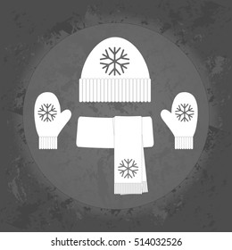 Winter icon, warm scarf hat and gloves on gray vintage background . Minimalism. Icon Logo