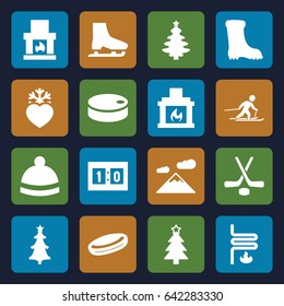 Winter icons set. set of 16 winter filled icons such as boot, winter hat, christmas tree, heart frozen, christmas tree, fireplace, heating system, skiing, sport score, hockey