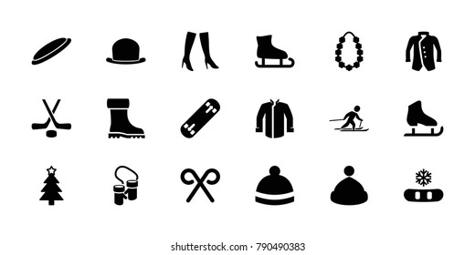 Winter icons. set of 18 editable filled winter icons: woman boots, winter hat, jacket, christmas tree, snowflake, ice skating, candy cane, garland, skiing, hockey, hat, boot