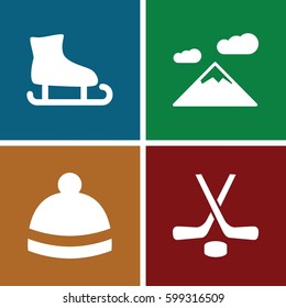winter icons set. Set of 4 winter filled icons such as winter hat, hockey, mountain