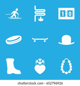 Winter icons set. set of 9 winter filled icons such as hat, boot, heart frozen, garland, heating system, skiing, sport score, hockey puck