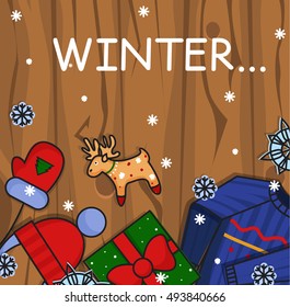 Winter illustration. Winter icons on wooden background.Hat, gloves and pullover.