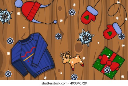 Winter illustration. Winter icons on wooden background.Hat, gloves and pullover.