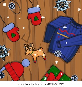Winter illustration. Winter icons on wooden background.Hat, gloves and pullover.