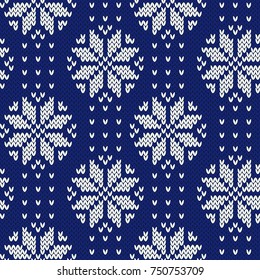 Winter jacquard knitted seamless pattern. Christmas background with snowflakes ornament. Scandinavian style. Vector illustration.