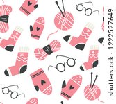 Winter knitted clothes and knitting tools seamless pattern - woolen socks, mittens, needles, hook, yarn, eyeglasses. Scandinavian christmas seamless pattern