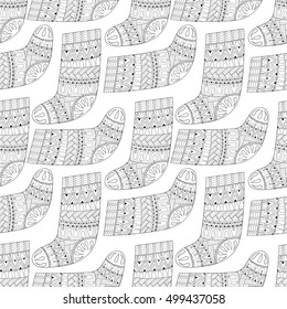 Winter knitted ethnic Sock for gift from Santa seamless pattern in zentangle style. Hand drawn Christmas decorative elements for adult coloring book. Vector illustration for New Year 2017.