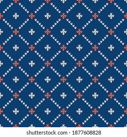 Winter knitted pattern. Nordic ethnic style ornament with dots and rhombs. Holiday vector background. Diamond pattern seamless texture.