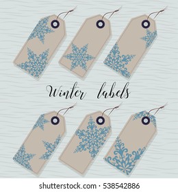 Winter labels. Six paper labels for gifts. Decorated twisted snowflakes.