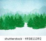 Winter landscape with falling snow, spruce forest and mountains. 
