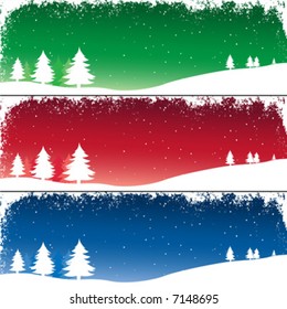 winter landscape with fir trees under falling snow