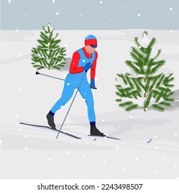 Winter landscape. A man on skis, spruce, against the backdrop of snowfall. Winter sports. Rest at nature.