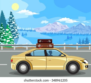 Winter landscape. Mountain tree in the snow, and cars on the road.