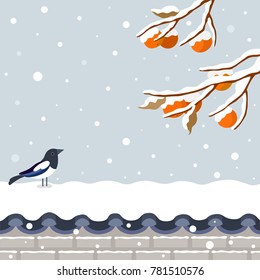 Winter landscape of snowy persimmon tree with magpie on snowy Korean traditional brick wall.Korean Traditional Happy New Year Day.