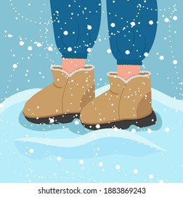 Winter. Legs in winter boots. Winter shoes. Snow, snowdrift.