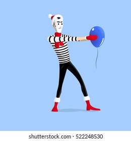 Winter mime performing a pantomime called balloon hypnosis